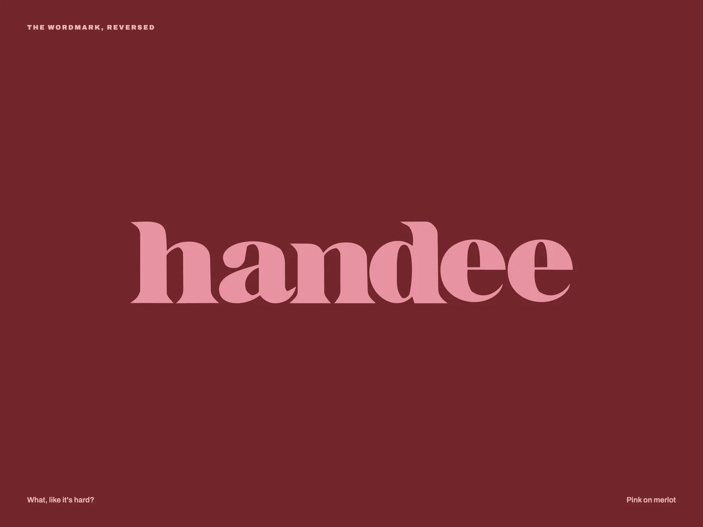 The wordmark in pink on merlot