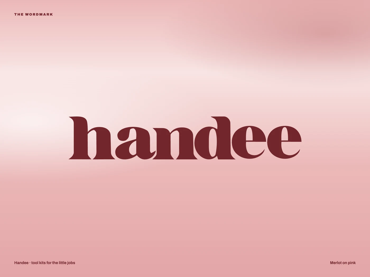 The handee wordmark in merlot on pink